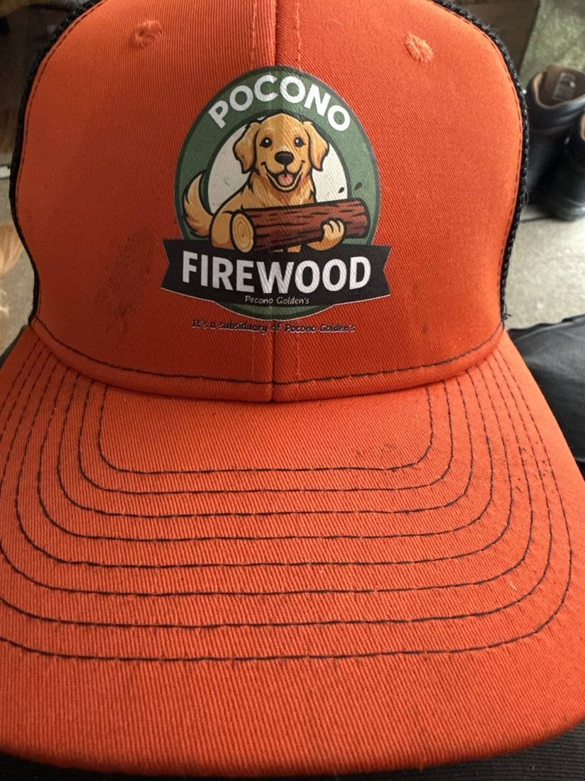Close-up of a Pocono Firewood branded cap