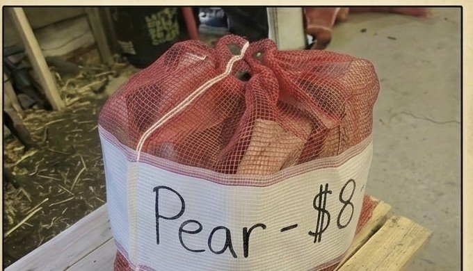 A tied bag of premium pear firewood