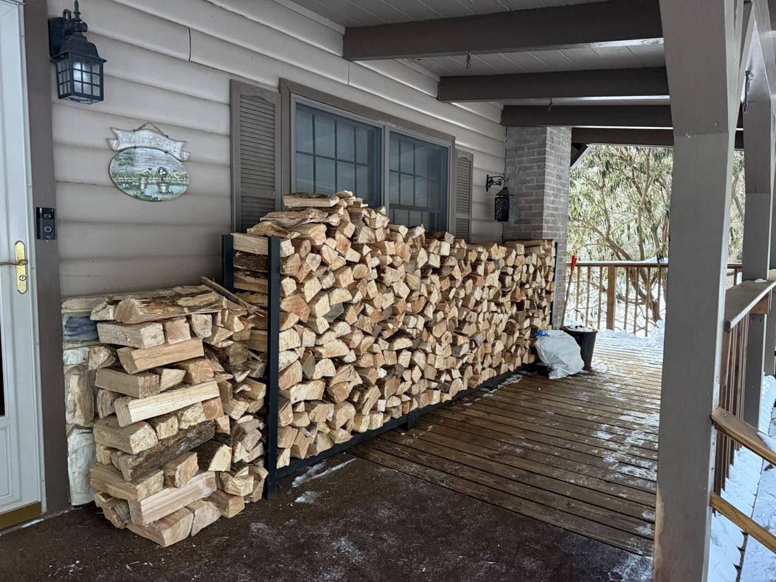 Firewood neatly stacked by our stacking service